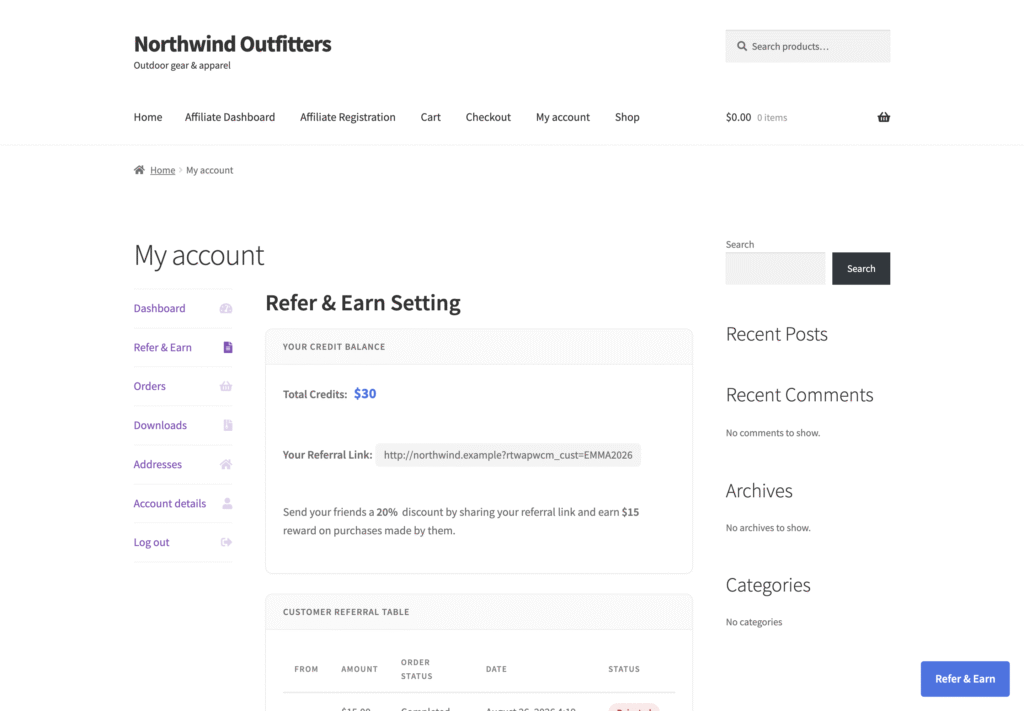 Refer & Earn tab in a customer’s My Account page on a WooCommerce store: total credits, the personal referral link, the sentence explaining the 20% friend discount and $15 reward, and a customer referral table