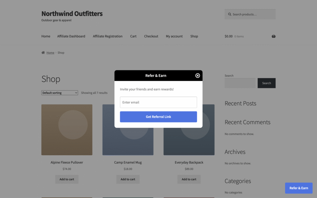 Refer & Earn pop-up on a WooCommerce shop page, opened from the floating Refer & Earn button, asking the customer for an email address to get a referral link